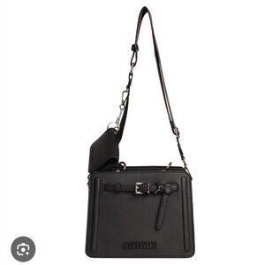Steve Madden black satchel high end, classic, sleek, date night, and sexy.